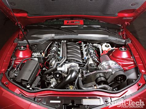 the engine compartment of a red sports car