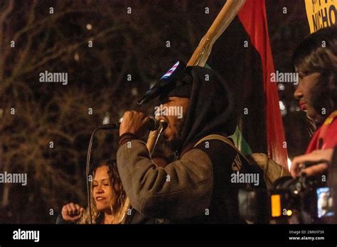 NEW YORK, NEW YORK - JANUARY 28: Activist speaks as protestors gather at Washington Square Park ...