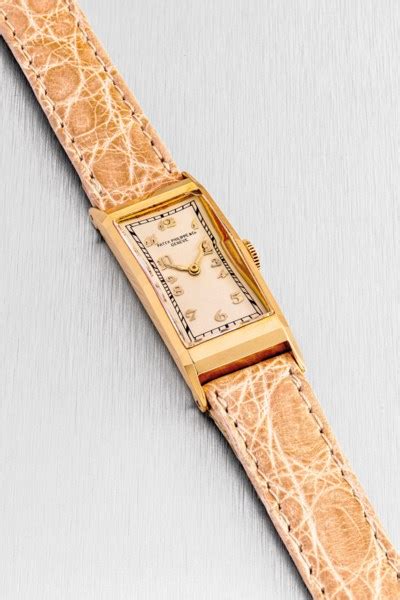 PATEK PHILIPPE. A LADY’S 18K GOLD RECTANGULAR WRISTWATCH , REF. 138, MANUFACTURED IN 1929 ...