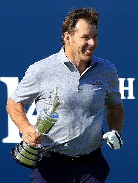 Nick Faldo celebrates 60th birthday by lifting Claret Jug from the first tee, sticking it up his ...