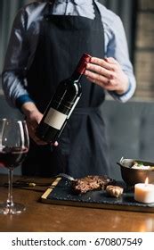 Man Holding Red Wine Bottle Stock Photo 670807549 | Shutterstock