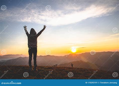 Man Praying at Sunset Mountains Raised Hands Travel Lifestyle Spiritual Relaxation Emotional ...