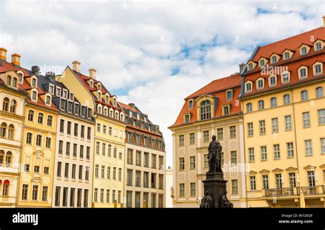 Monument and old buildings, European town Stock Photo - Alamy