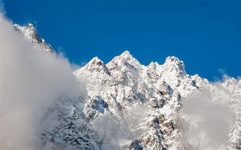 Peaks of high mountains stock photo. Image of clear - 165570172