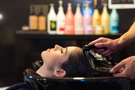 Woman Washing Hair In Hair Salon Stock Photo - Download Image Now - iStock