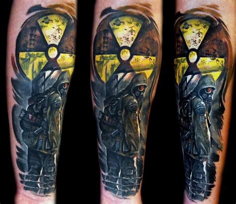 Awesome colored arm tattoo of Stalker emblem with man in gas mask - Tattooimages.biz