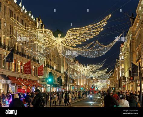 View looking up at the festive Christmas Angel decorations at night in ...