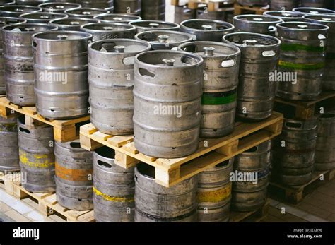 beer kegs. many metal beer keg stand in rows in a warehouse Stock Photo - Alamy