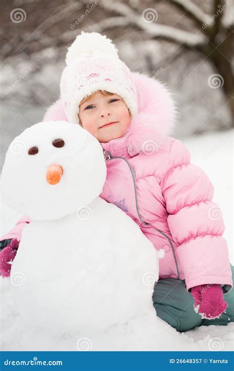 Child With Snowman Royalty Free Stock Photography - Image: 26648357