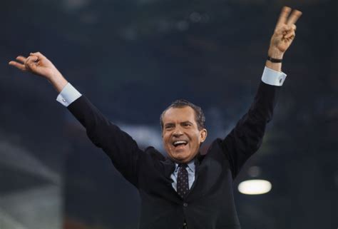 richard-nixon-raising-his-arms-to-crowd - Richard Nixon Pictures - Richard M. Nixon - HISTORY.com