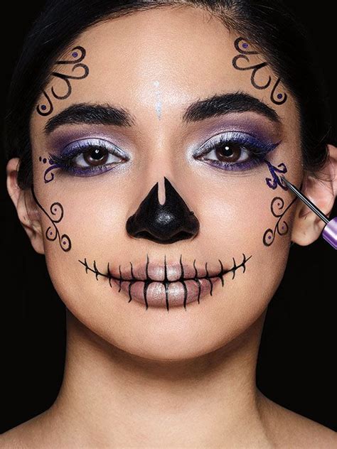 Learn how to do a sugar skull makeup look in this easy halloween makeup ...