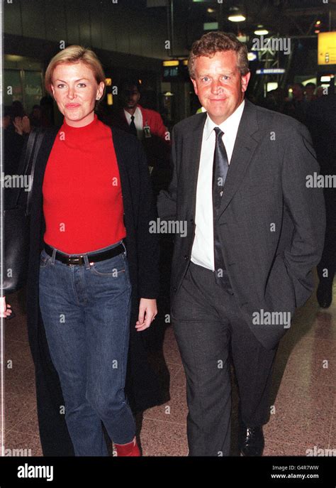 Golfer colin montgomerie wife elmear arrive london heathrow airport hi-res stock photography and ...