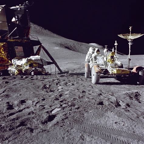 Apollo 15 astronaut loads the lunar rover with tools and equipment ...