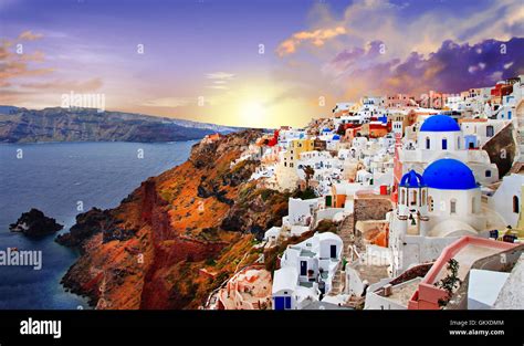 Santorini sunset, view of Oia village and caldera Stock Photo - Alamy