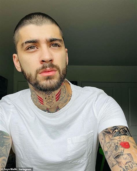 Zayn Malik shows off his array of new arm and neck tattoos as he poses ...