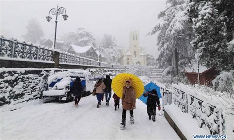 People play in snowfall, India - Global Times