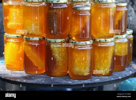 Jars of Honey with Honeycomb Stock Photo - Alamy