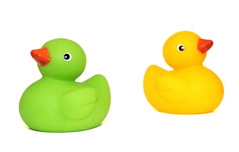 Yellow Duck Toy Beside Green Duck Toy · Free Stock Photo