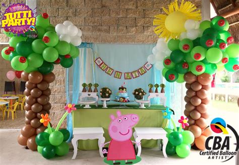 a peppa pig birthday party with balloons and decorations