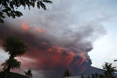 Thousands flee Agung as Bali volcano erupts sending plumes of ash and gas 4,000 meters above the ...