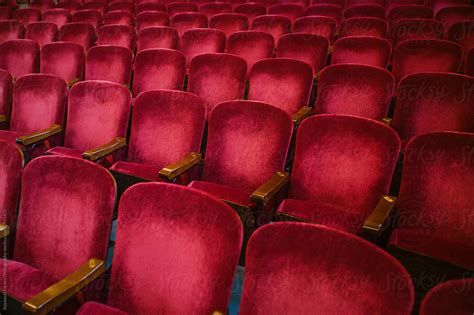 "Plush Velvet Red Theater Seats" by Stocksy Contributor "Raymond Forbes LLC" - Stocksy