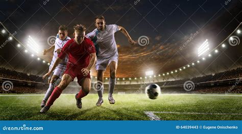 Soccer Players In Action On Sunset Stadium Background Panorama Stock Photo - Image: 64039443