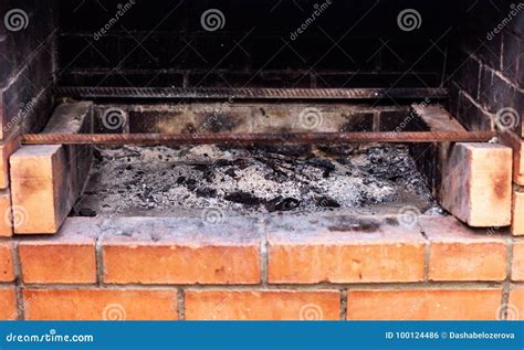 Ash in brick fireplace stock photo. Image of setting - 100124486