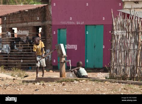 TORIT, SOUTH SUDAN-FEBRUARY 20, 2013: Unidentified children pump water ...