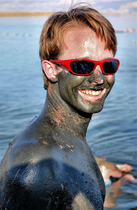 Young Man Covered in Dead Sea Mud at Dead Sea, Israel - Encircle Photos