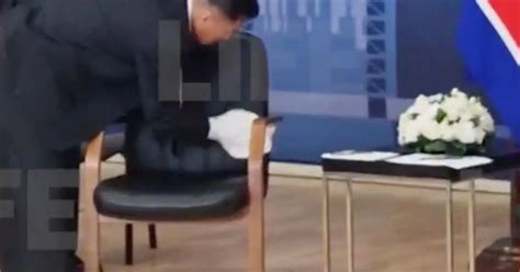 Bizarre moment Kim Jong-un's bodyguards sweeps his chair before meeting with Putin - World News ...