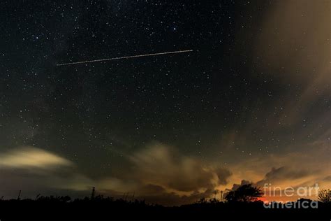 Night Sky With Aeroplane Trail Photograph by Clayton Bastiani