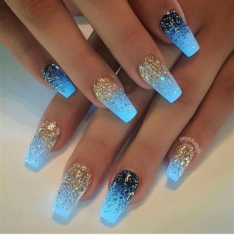Blue glow in the dark coffin nails manicure with gold glitter and blue glitter ombre effect ...
