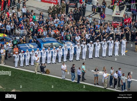 Crew members for the USS The Sullivans participate in pre race ...