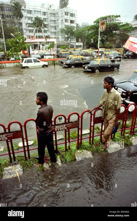 India Maharashtra Mumbai Bombay Monsoon wet people on flooded road Stock Photo - Alamy