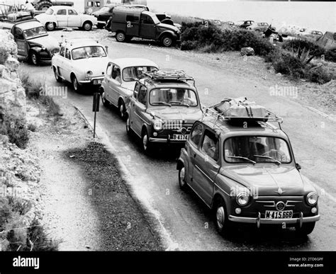 1963. A Seat 600 motorcade. Credit: Album / Archivo ABC Stock Photo - Alamy