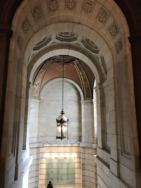 an archway with a light hanging from it