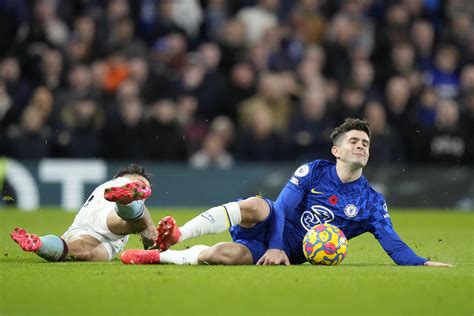 As Pulisic reports to US after injury, Chelsea urges caution | AP News