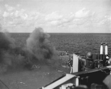 WWII Carriers — USS Ticonderoga burning after being hit by two...