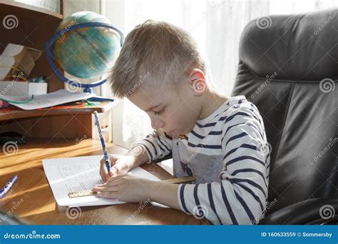 Boy is Doing Math Homework. he Draws a Pencil on the Ruler of the Answer To the Task Stock Image ...