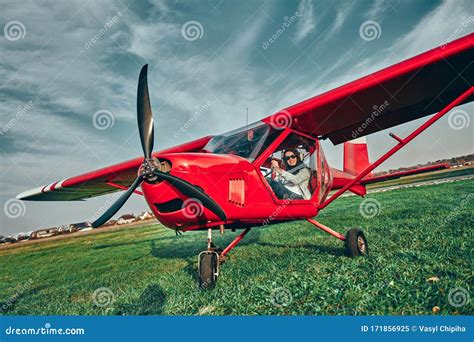 Small Private Aircraft Landed on the Field with Pilot in a Cockpit Stock Image - Image of relax ...