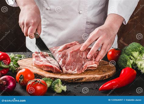 Chef Butcher Cutting Pork Meat with Knife on Kitchen, Cooking Food Stock Image - Image of ...