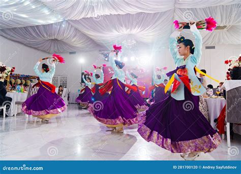 Dancers in National Costumes Dance a Traditional Korean Dance with a ...