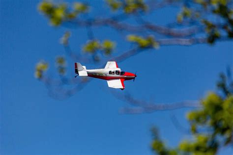 Bird Photography Of White And Red Biplane During Flight During Daytime ...