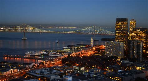 an aerial view of the bay bridge at night