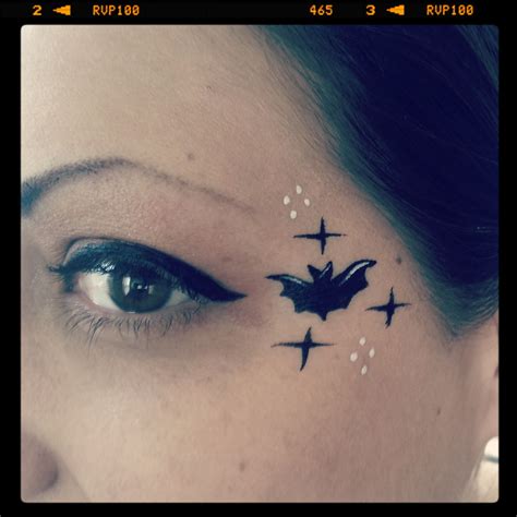 Teeny tiny bat eye design! Face painting by Glitter Goose. Paint ideas halloween vampire cute ...