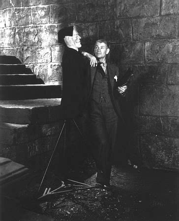 James Whale poses with a model of Frankenstein’s monster on the set of Bride of Frankenstein ...