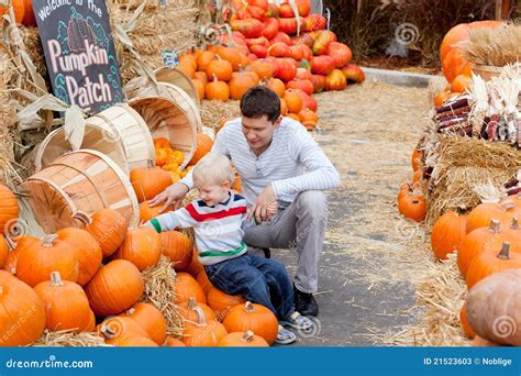 Family At The Pumpkin Patch Stock Photos - Image: 21523603