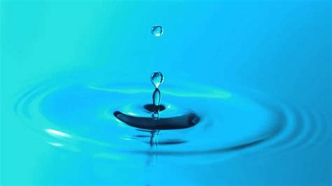 Slow Motion Water Droplet Falling Breaks Surface Tension and Makes ...
