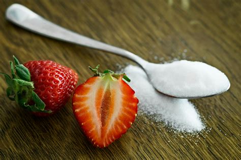 Strawberry Beside Spoon of Sugar · Free Stock Photo