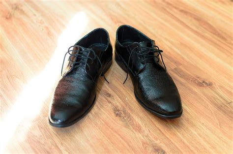 Black Leather Shoes on Flooring · Free Stock Photo